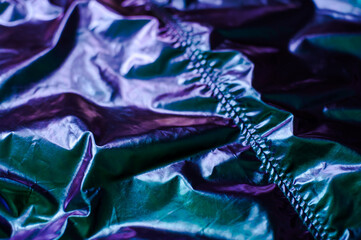 Holographic real texture in trendy colors with scratches and irregularities. Holographic color...