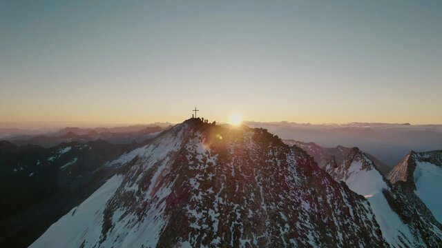 People standing on a summit during sunrise. Hochfeiler - Zillertaler Alpen.