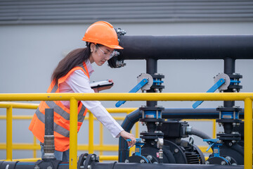 Worker under checking the waste water treatment pond industry large to control water support industry