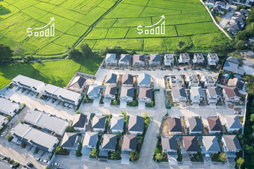 Increased land value in aerial view consist of landscape, green field, residential house building and growth graph of rate market price. Real estate or property for business i.e. trade or investment.