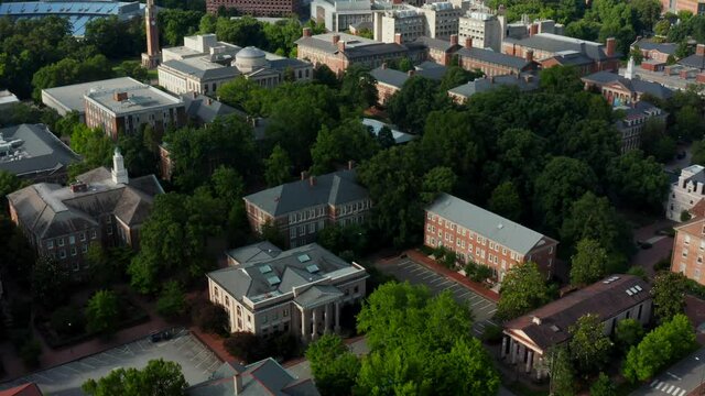 University of North Carolina campus grounds. Hospital Medical Center. Aerial reveal shot in summer. UNC.