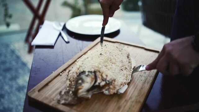 Tempting delicacy crispy fish fillet on flame fire 