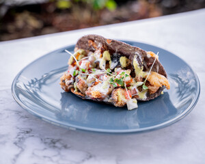 Tasty octopus taco with cream.