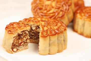 traditional Chinese baked mooncake lotus, egg yolk, red bean, mixed nuts pastry for mid autumn festival