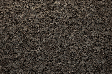 Brown granite texture background. Close-up of granite surface.