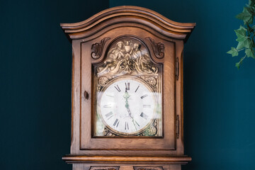 an antique clock on a background