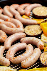 Delicious assortment of meat neck steak and vegetables grilling on a BBQ