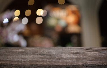 Empty wooden table in front of abstract blurred background of coffee shop . can be used for display or montage your products.Mock up for display of product