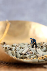 Workers handling medicinal horsetail grass in a miniature world