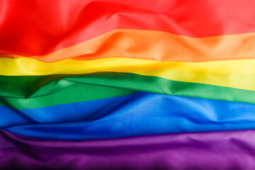 Top view rainbow flag background, international symbol of LGBT community, sign of diversity and gender equality in rights.