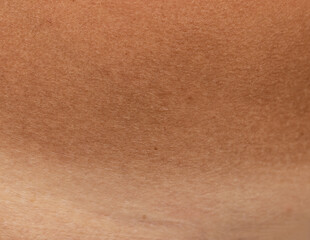 contrast of tanned and fair skin as background