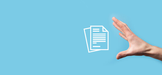 Male hand holding a document icon on blue background. Document Management Data System Business...