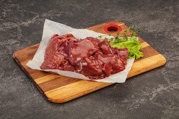 Raw chicken liver over board