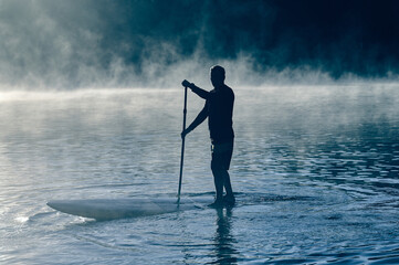 Man balancing on sup board