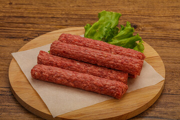 Raw beef sausages with spices