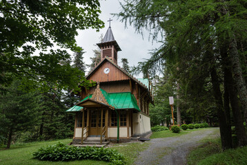 Fototapeta na wymiar Wooden Church of Assumption of the Holy Virgin in Tatranska Kotlina, NP Belianske Tatry, Slovakia