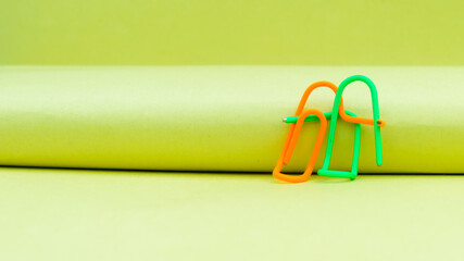 Happy couple sitting in a sweet pose. Abstract Human Figure of Paper Clip. Creative Photography. Still Life. Copy Space