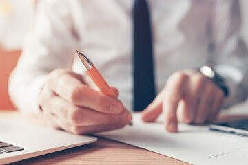 Sign the contract, businessman offering the pen and agreement papers