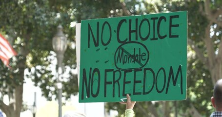 Sign protesting mandatory vaccines at an anti-vaccine passport rally in Los Angeles
