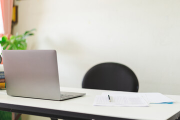 Student studying table and workplace with laptop and notebook in home office during COVID-19 pandemic