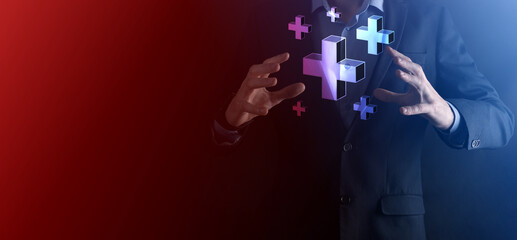 Businessman hold 3D plus icon, man hold in hand offer positive thing such as profit, benefits, development, CSR represented by plus sign.The hand shows the plus sign