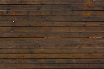 Obraz premium Texture of a wall from dark wooden planks