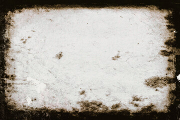 Vintage grunge light gray background in a dark frame with spots and scuffs.
