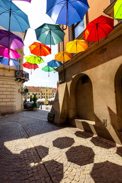 Piekarska street near Town Square decorated with colorful umbrellas, Tarnow, Poland