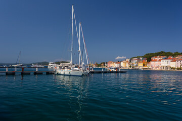 Fototapeta na wymiar yacht moored at the wooden pier in harbour of Losinj town, Croatia.