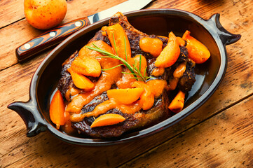 Veal steak fried with apricots