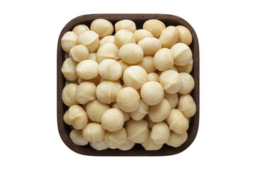 macadamia nuts peeled in square bowl isolated on white background. organic food, top view.