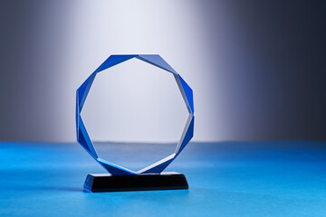 close up of crystal trophy on colored background