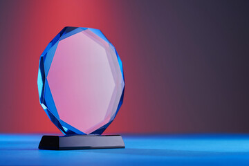 close up of crystal trophy on colored background