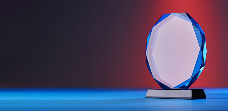close up of crystal trophy on colored background