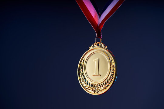 gold medal on the colored background