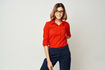 woman in red shirt posing fashion official light background