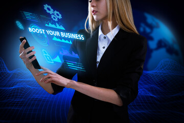 Business, Technology, Internet and network concept. Young businessman working on a virtual screen of the future and sees the inscription: Boost your business