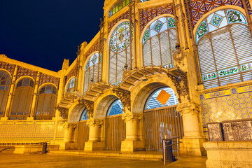 Fototapeta premium Central Market of Valencia illuminated in the night . Mercado Central public market in Valencia Spain 