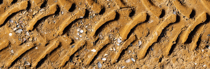 Top view on tire track in the sand. Panorama of tire track, suitable for header or banner. Off road...