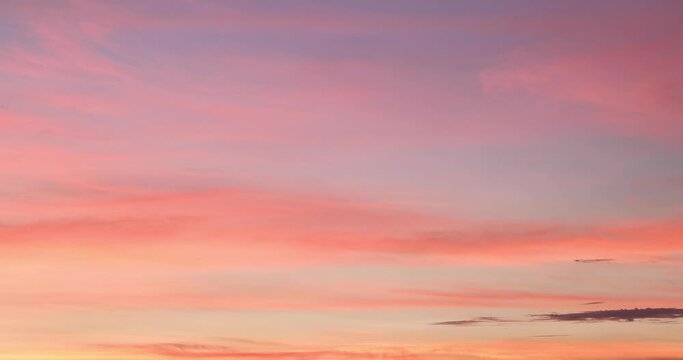 slowly moving beautiful pinky clouds in sky during sunset Red purple orange blue pink sunset sky cloud background.