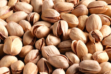 Scattered pistachio nuts. Background. Selective focus. Close-up.