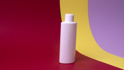 packaging of face or hand cream on colored background