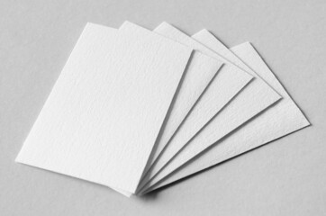 Textured business card mockup, vertical orientation. 55x85 mm.