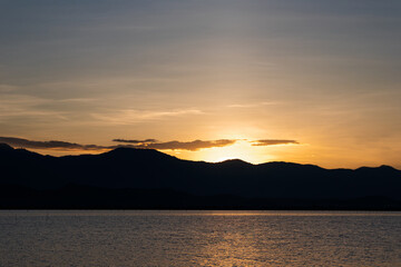 Fototapeta premium Natural scenery of sunset and mountains with the river in the evening, Phayao, Thailand