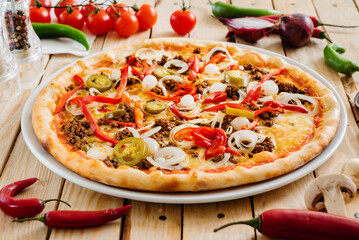tasty pizza on the wooden background