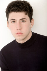 Obraz premium portrait of handsome caucasian boy looking at camera with serious expression