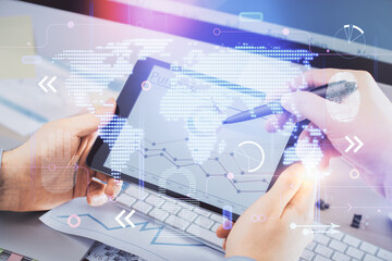 Multi exposure of man's hands holding and using a digital device and map drawing. International business concept.