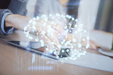 Double exposure of man and woman working together holding and using a mobile device and brain...
