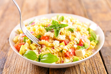 mixed pasta salad with tomato and basil