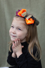 portrait of a girl with halloween hairpins in her hair, halloween party decoration concept